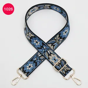 Ethnic floral jacquard bag strap with gold metal hardware, stylish replacement crossbody belt.