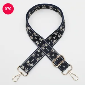 Ethnic style jacquard wide bag strap with adjustable gold hardware for crossbody bags.