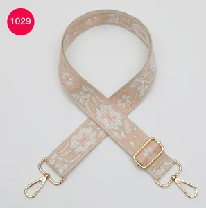 Woven bag strap replacement, ethnic floral jacquard design with gold hardware hooks.