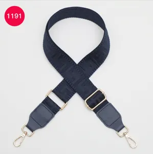 Adjustable replacement canvas bag strap with geometric pattern and gold metal hardware.