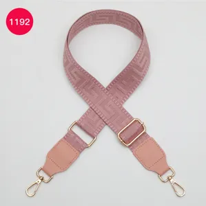 Woven wide bag strap with pink PU leather ends and gold hardware, geometric Greek key pattern.