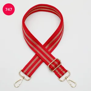 Adjustable red woven replacement bag strap with gold-tone hardware for shoulder purses.