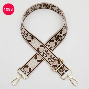 Ethnic jacquard wide bag strap replacement, adjustable length with gold hardware details.