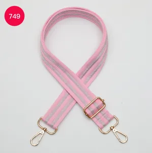 Adjustable pink and grey striped wide bag strap with gold-tone metal hardware clips.