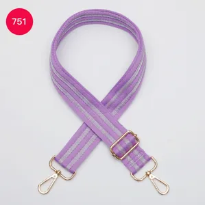 Adjustable wide replacement bag strap with gold metal hardware and durable woven fabric design.