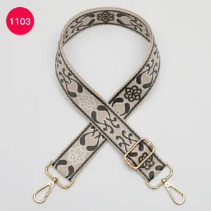 Ethnic jacquard wide replacement bag strap featuring durable adjustable gold hardware.