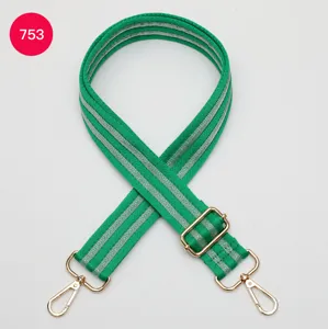Adjustable green wide bag strap with silver stripes and gold hardware, stylish replacement.