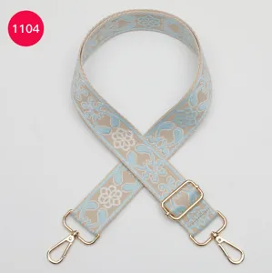Ethnic style jacquard wide bag strap detail, adjustable length with durable gold hardware.