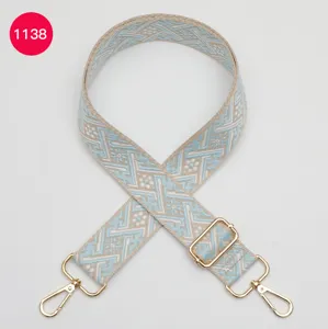 Sangle de sac tissée réglable de rechange avec motif géométrique et quincaillerie dorée.