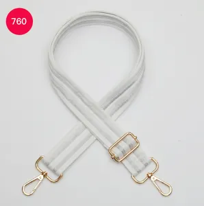 Detailed view of the wide adjustable white woven bag strap featuring premium gold hardware hooks.