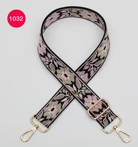 Ethnic floral jacquard wide bag strap replacement with gold hardware and adjustable buckle.