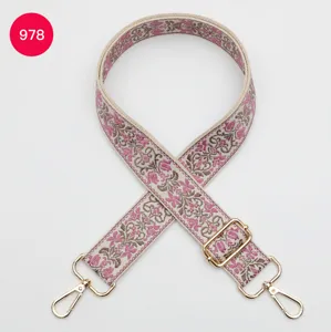 Close-up detail of 3.8cm ethnic jacquard bag strap with adjustable buckle and hooks.