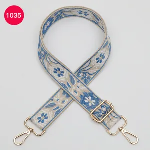 Ethnic floral jacquard replacement bag strap with gold hardware for stylish crossbody bags.