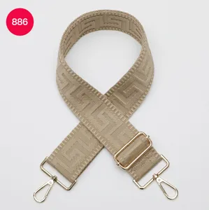 Beige woven replacement bag strap with geometric labyrinth pattern and gold hardware.