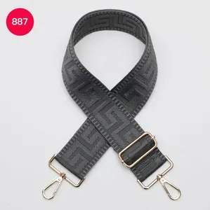 Dark grey wide replacement bag strap featuring geometric pattern and gold metal hardware.