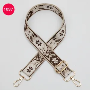 Ethnic floral jacquard wide bag strap replacement accessory with gold hardware for bags.