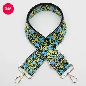 Detailed view of the 5cm ethnic style embroidered wide bag strap replacement with metal hooks.