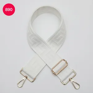 Replacement shoulder strap with white labyrinth geometric pattern and gold hardware for bags.
