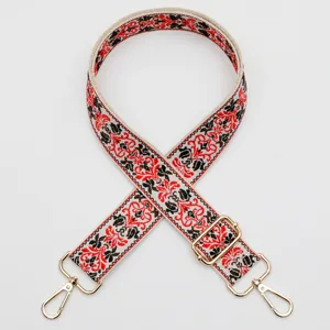 Ethnic style wide replacement bag strap with intricate woven floral patterns and gold hardware.
