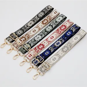 Colorful ethnic embroidered wide bag straps with gold hardware, adjustable and stylish.