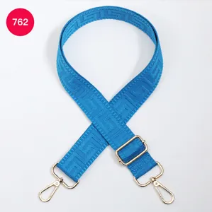 Blue replacement bag strap with geometric pattern, adjustable crossbody shoulder strap hardware.