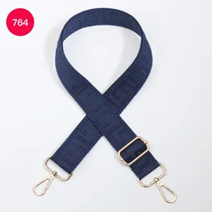 Adjustable navy blue bag strap featuring stylish maze pattern and durable gold metal hardware.