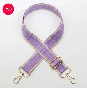 Adjustable wide purple labyrinth canvas bag strap replacement with gold hardware.