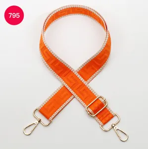 Adjustable wide replacement shoulder strap for crossbody bags with orange maze pattern.