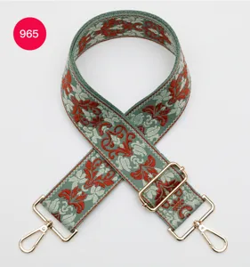 Jacquard wide bag strap detail, ethnic floral design, durable metal hardware, adjustable.