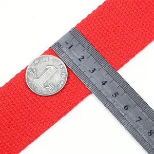 Red cotton canvas webbing strap for crossbody bag replacement, durable fabric material.