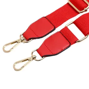 Red adjustable canvas bag strap replacement with gold hardware and PU leather ends for shoulder bags.