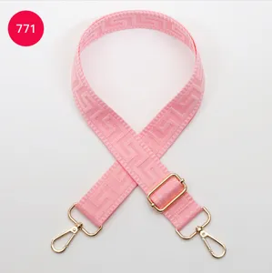 Pink replacement bag strap with gold hardware and geometric woven pattern for crossbody bags.