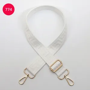White replacement bag strap with gold hardware and classic woven design, adjustable length.