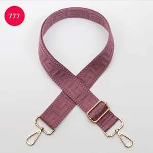 Adjustable wide replacement shoulder strap with geometric labyrinth pattern and gold hardware.