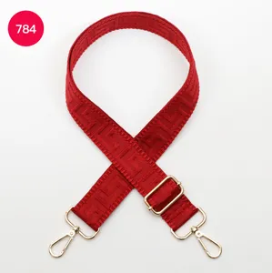 Red adjustable wide shoulder bag strap replacement with gold hardware and maze pattern.