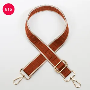 Adjustable wide replacement bag strap with colorful maze pattern and gold hardware.