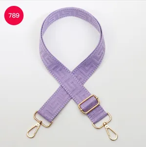 Adjustable purple wide replacement bag strap with gold hardware and stylish woven pattern.
