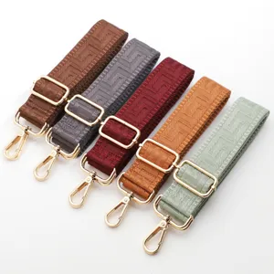 Adjustable replacement wide bag strap with geometric maze pattern and gold metal hardware.