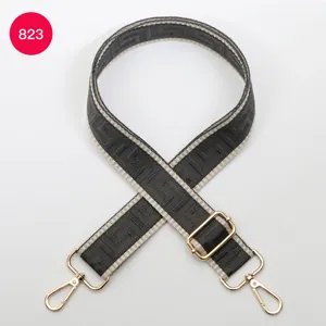 Adjustable replacement wide bag strap with geometric pattern and gold hardware. Perfect accessory.