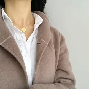 Gold coin pendant necklace for women, delicate vintage style chain jewelry for daily wear.