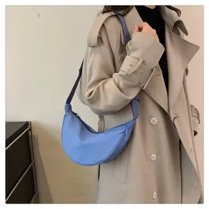 Light blue nylon crescent crossbody bag for women, casual zipper shoulder bag everyday use.