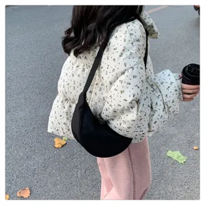 Black nylon crossbody dumpling bag, lightweight casual shoulder bag for women detail view.