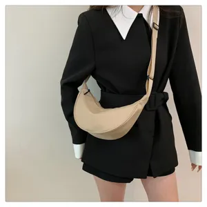 Nylon crossbody bag detailed view, trendy dumpling shoulder bag for casual outfits.