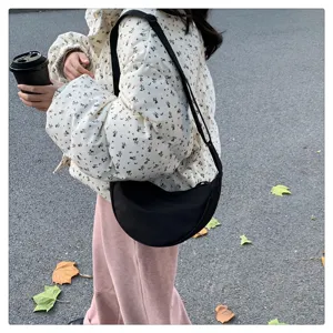 Black nylon crescent shoulder bag, lightweight crossbody bag for daily fashion and commute.