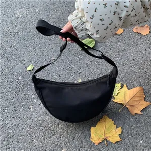 Casual black nylon crescent shoulder bag, lightweight crossbody dumpling bag for women everyday.