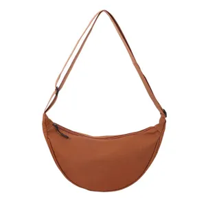 Brown nylon crescent shoulder bag, lightweight casual crossbody dumpling bag for women.