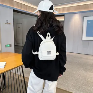 Mini corduroy backpack for women, stylish vintage casual small travel school bag.