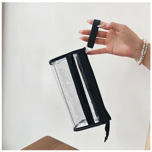 Astuccio trasparente in PVC con zip multiple e bordo nero, ideale per la scuola e il trucco.