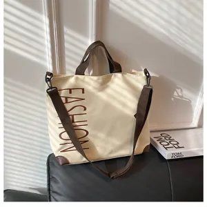 Casual canvas tote bag for women, large capacity shoulder bag, stylish commuter handbag.