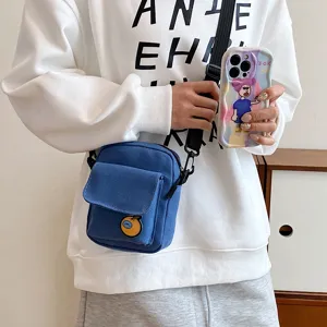 Cute canvas crossbody bag for women girls, casual small shoulder phone bag with orange patch.